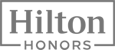 This image shows the "Hilton Honors" logo with the text in a bold font, enclosed in a rectangular frame.