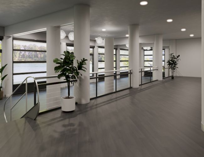 The image shows a modern, open indoor space with large windows, potted plants, pillars, and a sleek handrail.