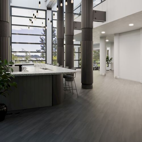 The image shows a modern interior with tall columns, large windows, a curved counter with stools, and potted plants, all in a spacious area.