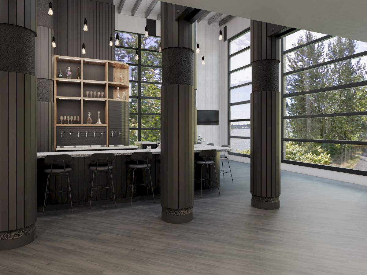 A modern interior space with high ceilings, tall windows, and a bar area featuring stools and shelves with bottles.