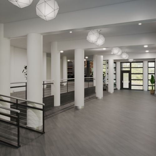 The image shows a modern, spacious hallway with large windows, columns, hanging lights, and a staircase to the left.
